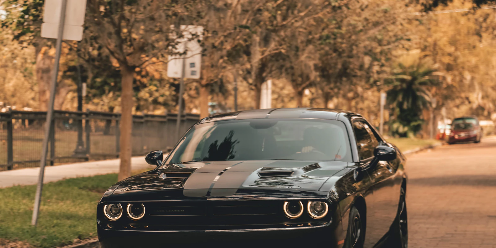 Black Dodge Challenger on a city street