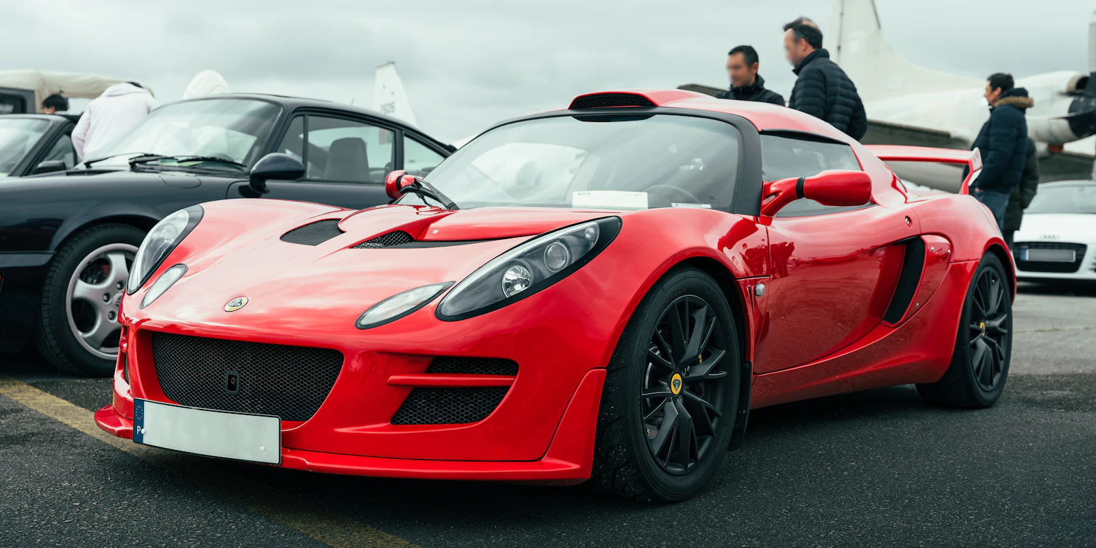 Red Lotus sports car at a car meet